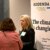 Photo taken during the Together25Ensemble conference featuring two women in conversation